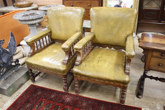 A pair of Victorian oak library chairs, upholstered in pale green leather, W.68cm D.76cm H.102cm